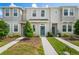 Charming townhome with neutral exterior, well-maintained landscaping, and inviting blue front door with wreath at 6240 Fairmont Ln, Palmetto, FL 34221