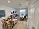 Living room showcasing dining area, stylish furniture, and a sliding glass door at 6240 Fairmont Ln, Palmetto, FL 34221