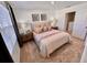 Bedroom with neutral carpeting, decor and a window with bright light at 6240 Fairmont Ln, Palmetto, FL 34221