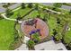 Aerial view of the playground surrounded by palm trees and green spaces at 6240 Fairmont Ln, Palmetto, FL 34221