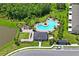 Community pool area with cabana, lush greenery and lounge seating at 6240 Fairmont Ln, Palmetto, FL 34221