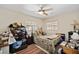 Standard bedroom with a ceiling fan, two windows, a bed, and storage at 6795 23Rd S St, St Petersburg, FL 33712