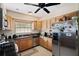 Bright kitchen with wood cabinetry, stainless steel appliances, and a functional layout for easy meal preparation and enjoyment at 6795 23Rd S St, St Petersburg, FL 33712