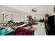 Inviting living room with terrazzo flooring, a ceiling fan, and lots of space for entertaining at 6795 23Rd S St, St Petersburg, FL 33712