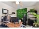 Office featuring a decorative plant wall, ceiling fan, and a modern work area at 6795 23Rd S St, St Petersburg, FL 33712