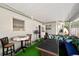 Covered patio featuring an outdoor table, a ceiling fan, and enclosed screens at 6795 23Rd S St, St Petersburg, FL 33712