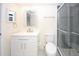 Bright bathroom featuring a vanity and a modern tiled shower at 6806 Beach Blvd, Hudson, FL 34667