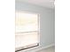 Bright bedroom with large window and blinds providing natural light at 6806 Beach Blvd, Hudson, FL 34667