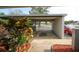 Covered carport area with parking spaces, offering protection for vehicles, and enhanced landscaping at 6806 Beach Blvd, Hudson, FL 34667