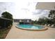 Large community pool provides a refreshing escape on sunny days with poolside seating at 6806 Beach Blvd, Hudson, FL 34667