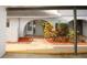 Inviting entrance featuring a charming arched doorway, well-kept landscaping, and a welcoming walkway at 6806 Beach Blvd, Hudson, FL 34667