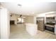 Open-concept living space with kitchen featuring stainless steel appliances and a center island at 6806 Beach Blvd, Hudson, FL 34667