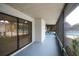 Spacious screened lanai with covered ceiling and views of the community swimming pool at 6806 Beach Blvd, Hudson, FL 34667