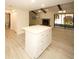 Spacious room with fireplace, beams, and view to kitchen and outdoor space at 6806 Beach Blvd, Hudson, FL 34667