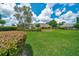 Lush green backyard with blooming flowers, ideal for enjoying the beauty of nature and relaxing outdoors at 7275 Crystal Spring Run, Weeki Wachee, FL 34607
