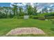 Beautiful green backyard with statues and manicured hedges, perfect for relaxation and outdoor activities at 7275 Crystal Spring Run, Weeki Wachee, FL 34607