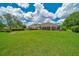 Expansive backyard with lush green grass, perfect for outdoor activities and relaxation at 7275 Crystal Spring Run, Weeki Wachee, FL 34607