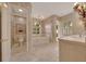Elegant bathroom with a soaking tub, tiled floors, and decorative artwork at 7275 Crystal Spring Run, Weeki Wachee, FL 34607