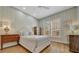 Bright bedroom with wood floors, neutral color scheme, and plenty of natural light at 7275 Crystal Spring Run, Weeki Wachee, FL 34607