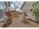 Private brick courtyard with decorative potted plants and foliage at 7275 Crystal Spring Run, Weeki Wachee, FL 34607