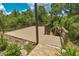 Community deck surrounded by lush greenery offers a tranquil space to relax and enjoy the natural setting at 7275 Crystal Spring Run, Weeki Wachee, FL 34607