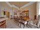 Elegant dining room with a chandelier and large table, perfect for entertaining at 7275 Crystal Spring Run, Weeki Wachee, FL 34607