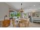 Cozy dining room with views of the outdoor pool and lanai area at 7275 Crystal Spring Run, Weeki Wachee, FL 34607