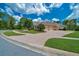Spacious brick driveway leading to a well-maintained home with a manicured lawn and attached two-car garage at 7275 Crystal Spring Run, Weeki Wachee, FL 34607