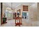 Elegant foyer with marble floors, chandelier, decorative table, and detailed trim work at 7275 Crystal Spring Run, Weeki Wachee, FL 34607