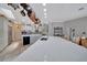 Bright kitchen features a large island, modern appliances, and a pot rack at 7275 Crystal Spring Run, Weeki Wachee, FL 34607