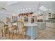 Kitchen with a large island, breakfast bar, stainless appliances and custom cabinetry at 7275 Crystal Spring Run, Weeki Wachee, FL 34607
