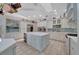 Spacious kitchen with a large island, stainless steel appliances, and custom cabinetry at 7275 Crystal Spring Run, Weeki Wachee, FL 34607