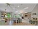 Spacious living room with fireplace and views of the outdoor pool at 7275 Crystal Spring Run, Weeki Wachee, FL 34607