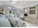 Open living room features fireplace, skylights and seating with a view of the pool at 7275 Crystal Spring Run, Weeki Wachee, FL 34607