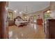 Main bedroom featuring wood floors, a chandelier and access to a private patio at 7275 Crystal Spring Run, Weeki Wachee, FL 34607