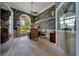 Home office featuring custom wallpaper, a large window, and hardwood floors at 7275 Crystal Spring Run, Weeki Wachee, FL 34607