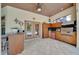 Convenient outdoor kitchen area with stainless steel grill, bar seating, and a view of the pool at 7275 Crystal Spring Run, Weeki Wachee, FL 34607