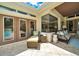 Charming outdoor patio with seating, a chaise lounge, and a view of the beautifully landscaped backyard at 7275 Crystal Spring Run, Weeki Wachee, FL 34607