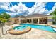 Gorgeous pool and hot tub with clear blue water, surrounded by a spacious patio at 7275 Crystal Spring Run, Weeki Wachee, FL 34607