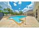 Inviting backyard pool area with a hot tub and seating, perfect for outdoor gatherings at 7275 Crystal Spring Run, Weeki Wachee, FL 34607