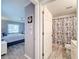 Hallway showing entry to bedroom and bathroom with toilet and shower/tub combination at 7518 Mediterranean Ct, Hudson, FL 34667