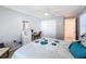 Bright bedroom with ceiling fan, closet, and light gray walls at 7518 Mediterranean Ct, Hudson, FL 34667