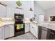 Modern kitchen with stainless steel appliances, granite counters, and tiled backsplash at 7518 Mediterranean Ct, Hudson, FL 34667