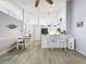 This well lit kitchen has a breakfast bar with seating for three, and an adjacent dining area at 7518 Mediterranean Ct, Hudson, FL 34667