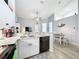 Bright kitchen has stainless steel appliances, granite countertops, and an adjacent dining area at 7518 Mediterranean Ct, Hudson, FL 34667