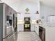 Kitchen has stainless steel appliances, granite counters, and ample storage at 7518 Mediterranean Ct, Hudson, FL 34667