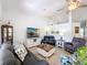 Open living space boasts vaulted ceilings, stylish furniture, and a seamless flow to the dining area at 7518 Mediterranean Ct, Hudson, FL 34667