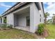 Private back patio with a sliding glass door, offering an outdoor space for relaxation and entertainment at 8305 Crescent Oaks Dr, New Port Richey, FL 34655