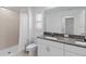 Bathroom with granite countertops, tiled shower, and ample natural light at 8305 Crescent Oaks Dr, New Port Richey, FL 34655