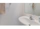 Cozy bathroom features a white sink and a mirror at 8305 Crescent Oaks Dr, New Port Richey, FL 34655